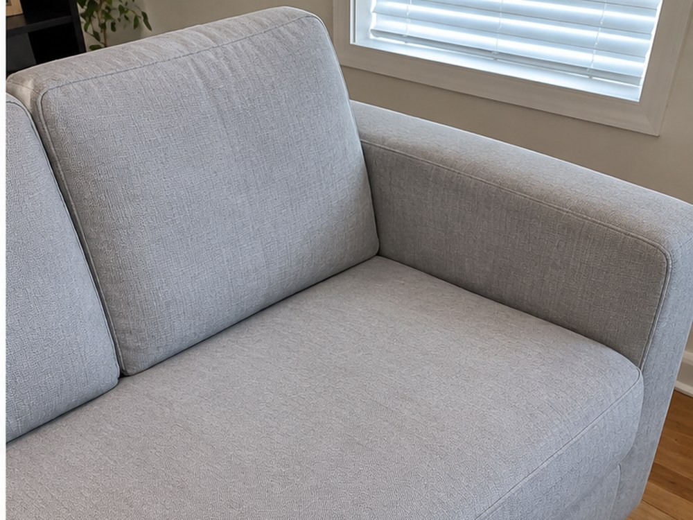 Same sofa cushion after professional MyKleaner upholstery cleaning, clean and refreshed